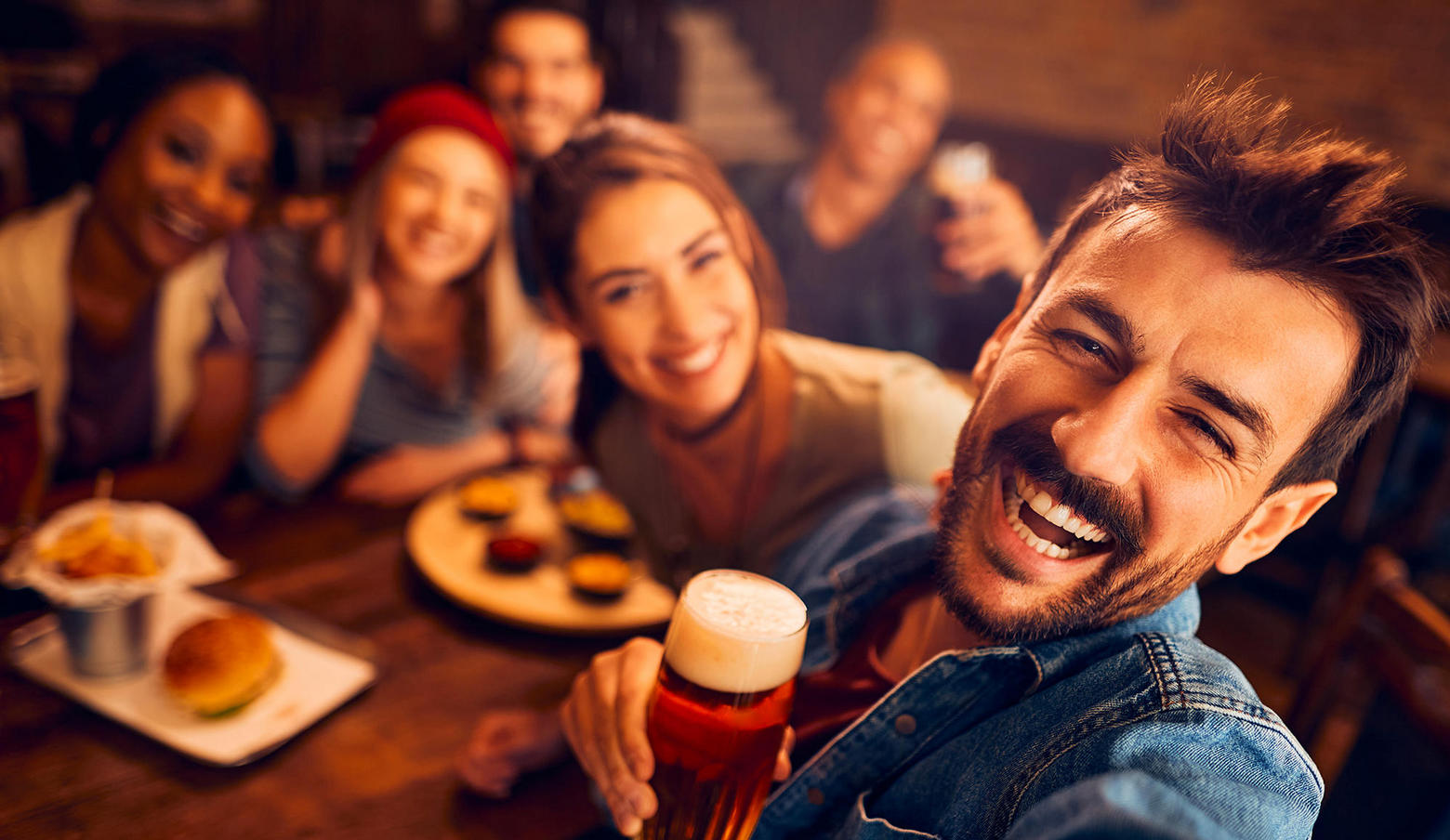 People drinking beer taking a selfie